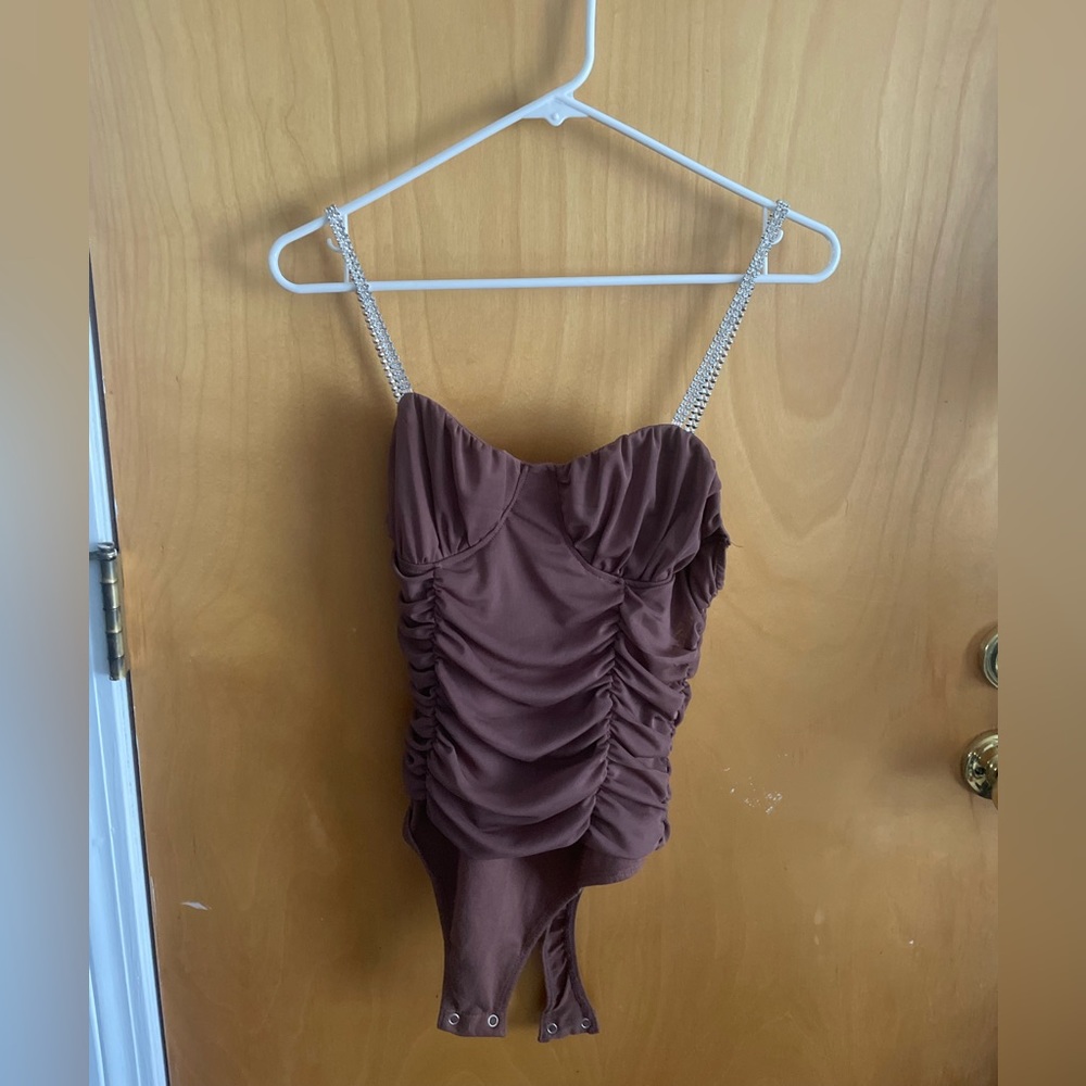 Brown bodysuit with silver straps